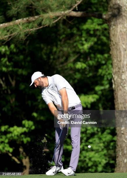 Scottie Scheffler of The United States plays his second shot on the 11th hole during the third round of the 2024 Masters Tournament at Augusta...