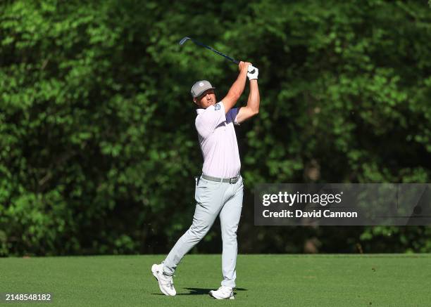 Scottie Scheffler of The United States plays his second shot on the 11th hole during the third round of the 2024 Masters Tournament at Augusta...