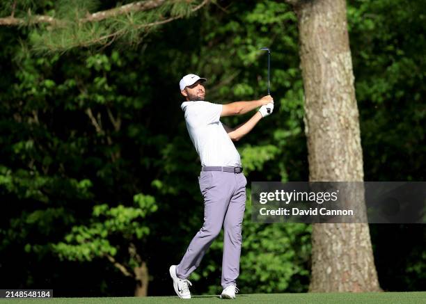 Scottie Scheffler of The United States plays his second shot on the 11th hole during the third round of the 2024 Masters Tournament at Augusta...