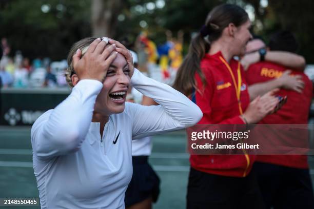 Ana Bogdan of Romania celebrates with her team after winning her doubles match with Jaqueline Cristian of Romania during the Billie Jean King Cup...
