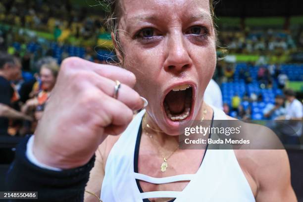 Laura Siegmund of Germany celebrates after winning the match against to Carolina Alves of Brazil during the Billie Jean King Cup Qualifier match...