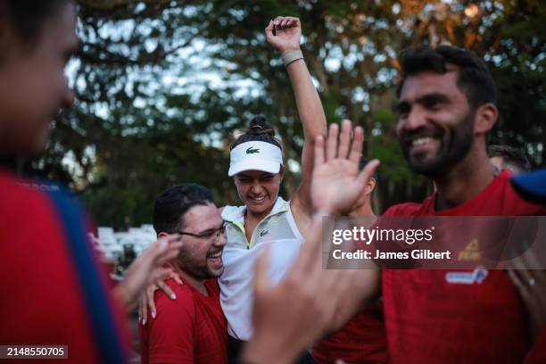 Jaqueline Cristian of Romania celebrates with her team after winning her doubles match with Ana Bogdan during the Billie Jean King Cup Qualifier...