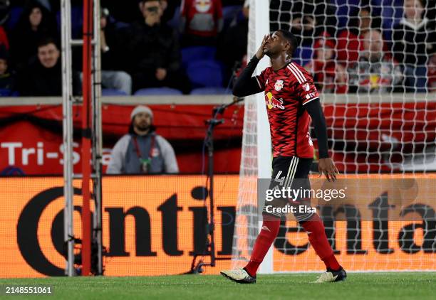 Andres Reyes of New York Red Bulls walks off the pitch after he was issued a red card during the first half aChicago Fire at Red Bull Arena on April...