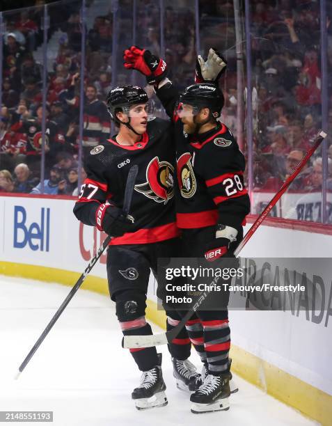 Shane Pinto of the Ottawa Senators celebrates his second period goal against the Montreal Canadiens with Claude Giroux at Canadian Tire Centre on...