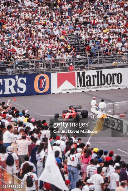 Alain Prost, #27, of the Ferrari team, drives to a second place finish in the Formula One United States Grand Prix held in Phoenix, Arizona in March...