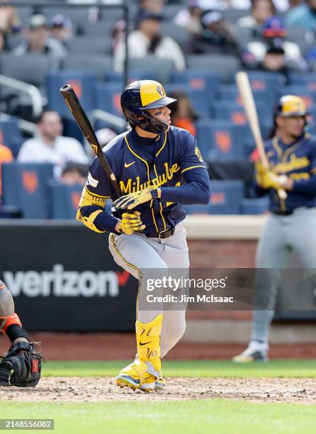 Christian Yelich of the Milwaukee Brewers follows through on an eighth inning RBI base hit against the New York Mets at Citi Field on March 30, 2024...