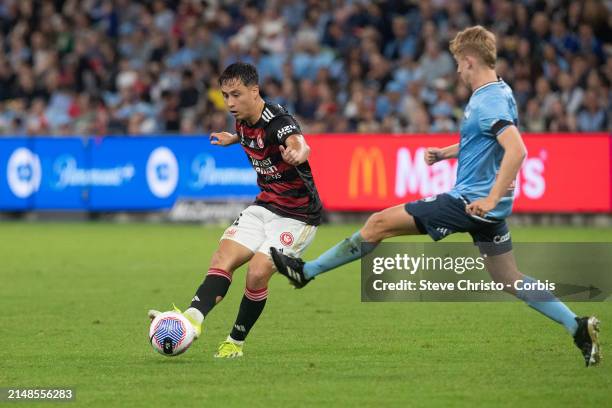 Aidan Simmons of the Wanderers passes the ball in front of Sydney FC's Jaiden Kucharski during the A-League Men round 24 match between Sydney FC and...