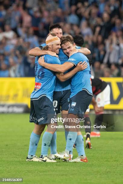 Luke Brattan, Joe Lolley and Corey Hollman of Sydney FC celebrate beating the Wanderers 2-1 during the A-League Men round 24 match between Sydney FC...