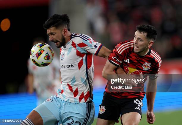 Mauricio Pineda of Chicago Fire and Lewis Morgan of New York Red Bulls fight for the ball during the second half at Red Bull Arena on April 13, 2024...