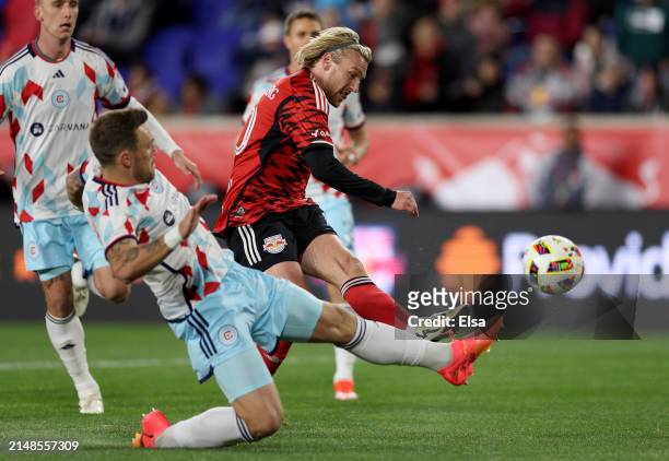 Emil Forsberg of New York Red Bulls heads for the net as Rafael Czichos of Chicago Fire defends during the first half at Red Bull Arena on April 13,...