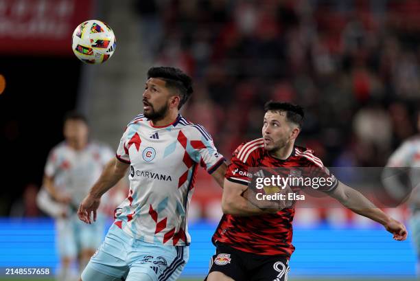 Mauricio Pineda of Chicago Fire and Lewis Morgan of New York Red Bulls fight for the ball during the second half at Red Bull Arena on April 13, 2024...