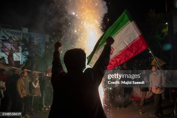 People gather in support of the Islamic Revolutionary Guard Corps' attack on Israel on April 14, 2024 in Tehran, Iran. Late on Saturday, Iran...