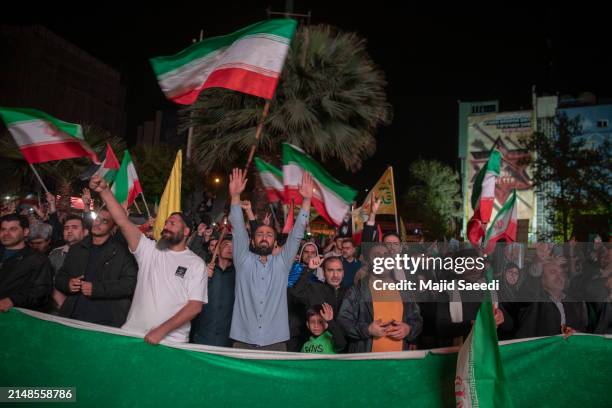 People gather in support of the Islamic Revolutionary Guard Corps' attack on Israel on April 14, 2024 in Tehran, Iran. Late on Saturday, Iran...