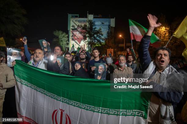 People gather in support of the Islamic Revolutionary Guard Corps' attack on Israel on April 14, 2024 in Tehran, Iran. Late on Saturday, Iran...