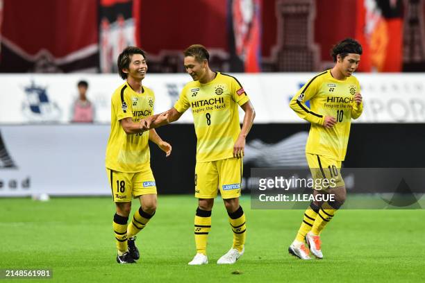 Yusuke Segawa of Kashiwa Reysol celebrates with teammates Kei Koizumi and Araru Esaka after scoring the team's first goal during the J.League J1...