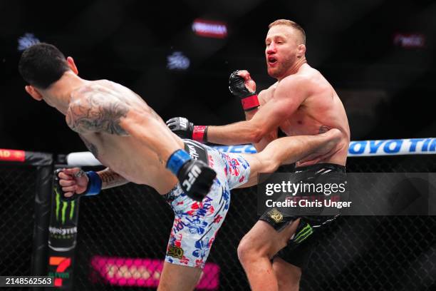 Max Holloway kicks Justin Gaethje in a lightweight fight during the UFC 300 event at T-Mobile Arena on April 13, 2024 in Las Vegas, Nevada.