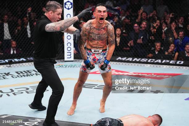 Max Holloway reacts to the knockout of Justin Gaethje in the BMF championship fight during the UFC 300 event at T-Mobile Arena on April 13, 2024 in...