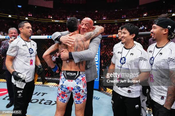 las-vegas-nevada-max-holloway-hugs-mark-coleman-after-receiving-the-belt-in-the-bmf.jpg