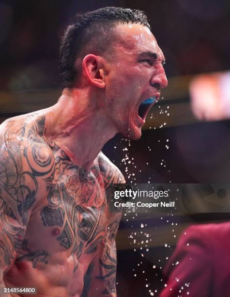 Max Holloway reacts to his knockout of Justin Gaethje in the BMF championship fight during the UFC 300 event at T-Mobile Arena on April 13, 2024 in...