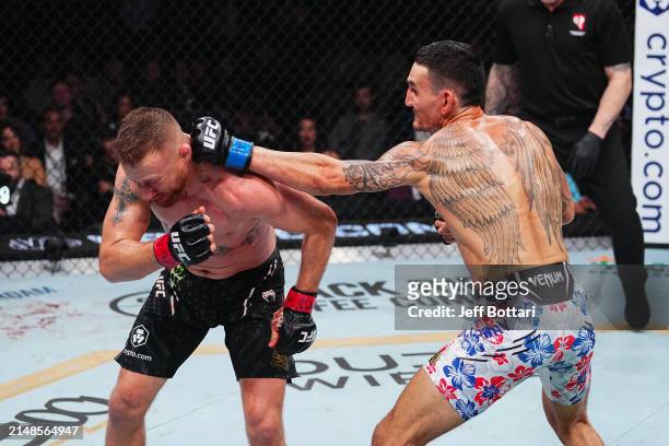 Max Holloway punches Justin Gaethje in the BMF championship fight during the UFC 300 event at T-Mobile Arena on April 13, 2024 in Las Vegas, Nevada.