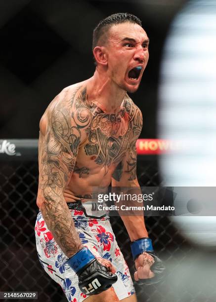 Max Holloway reacts to defating Justin Gaethje in their BMF title fight at T-Mobile Arena on April 13, 2024 in Las Vegas, Nevada.