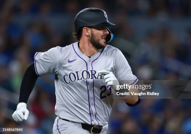 Kris Bryant of the Colorado Rockies runs to first base against the Toronto Blue Jays at Rogers Centre on April 12, 2024 in Toronto, Ontario, Canada.