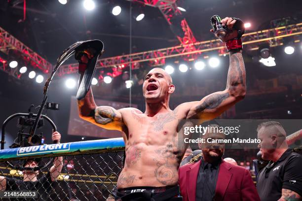 Alex Pereira of Brazil reacts to defeating Jamahal Hill in their light heavyweight championship fight at T-Mobile Arena on April 13, 2024 in Las...