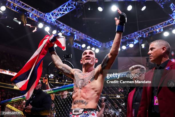 Max Holloway reacts to defeating Justin Gaethje in their BMF title fight at T-Mobile Arena on April 13, 2024 in Las Vegas, Nevada.