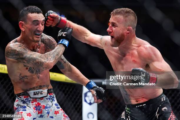 Justin Gaethje and Max Holloway exchange strikes during their BMF title fight at T-Mobile Arena on April 13, 2024 in Las Vegas, Nevada.