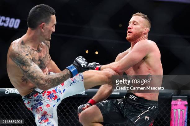 Justin Gaethje and Max Holloway exchange strikes during their BMF title fight at T-Mobile Arena on April 13, 2024 in Las Vegas, Nevada.