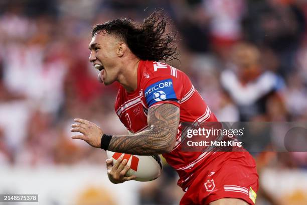 Jaydn Su'a of the Dragons runs to the line score a try during the round six NRL match between Wests Tigers and St George Illawarra Dragons at...