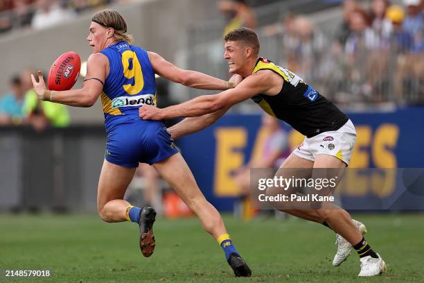 Harley Reid of the Eagles fends off Ben Miller of the Tigers during the round five AFL match between West Coast Eagles and Richmond Tigers at Optus...