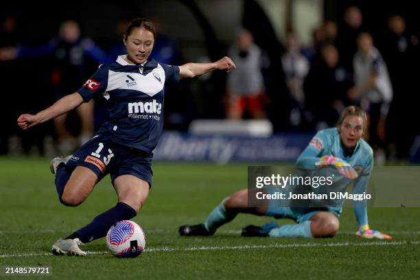 Kurea Okino of Melbourne Victory gets past Mariners' goalkeeper Casey Dumont during the A-League Women Elimination Final match between Melbourne...