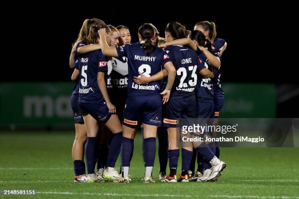 Victory players come together following defeat through penalty shootout during the A-League Women Elimination Final match between Melbourne Victory...