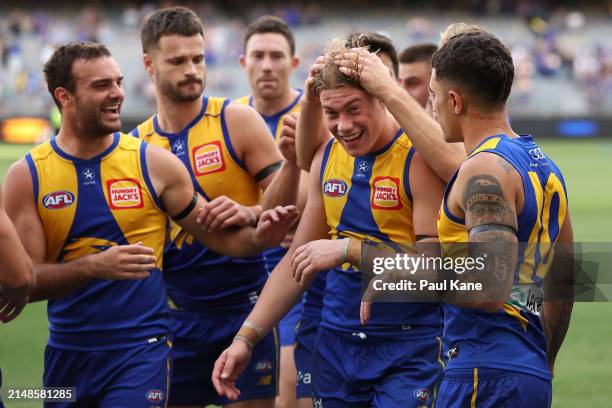 Team mates get around Harley Reid of the Eagles after winning the round five AFL match between West Coast Eagles and Richmond Tigers at Optus...