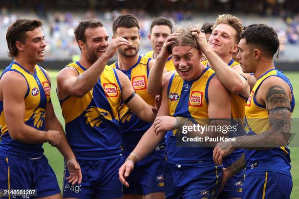 Team mates get around Harley Reid of the Eagles after winning the round five AFL match between West Coast Eagles and Richmond Tigers at Optus...