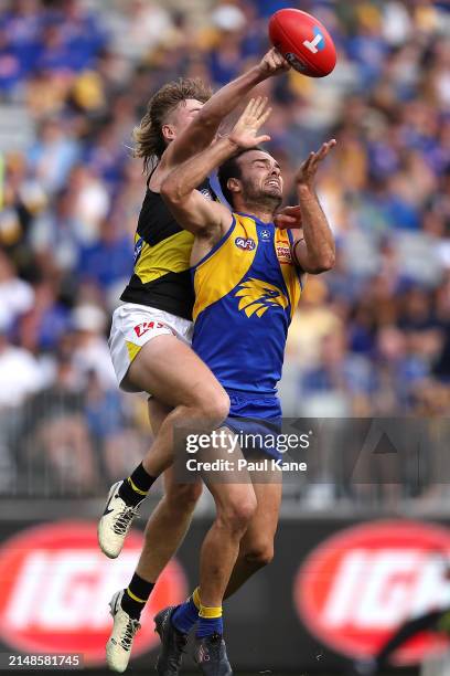 Hugo Ralphsmith of the Tigers spoils the mark for Jack Petruccelle of the Eagles during the round five AFL match between West Coast Eagles and...