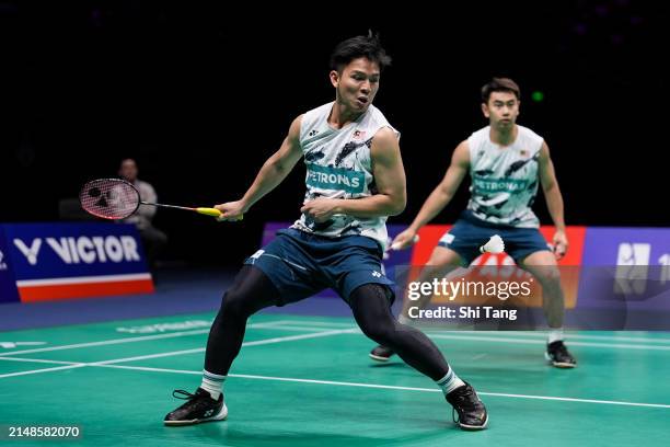 Goh Sze Fei and Nur Izzuddin of Malaysia compete in the Men's Doubles Final match against Liang Weikeng and Wang Chang of China during day six of the...
