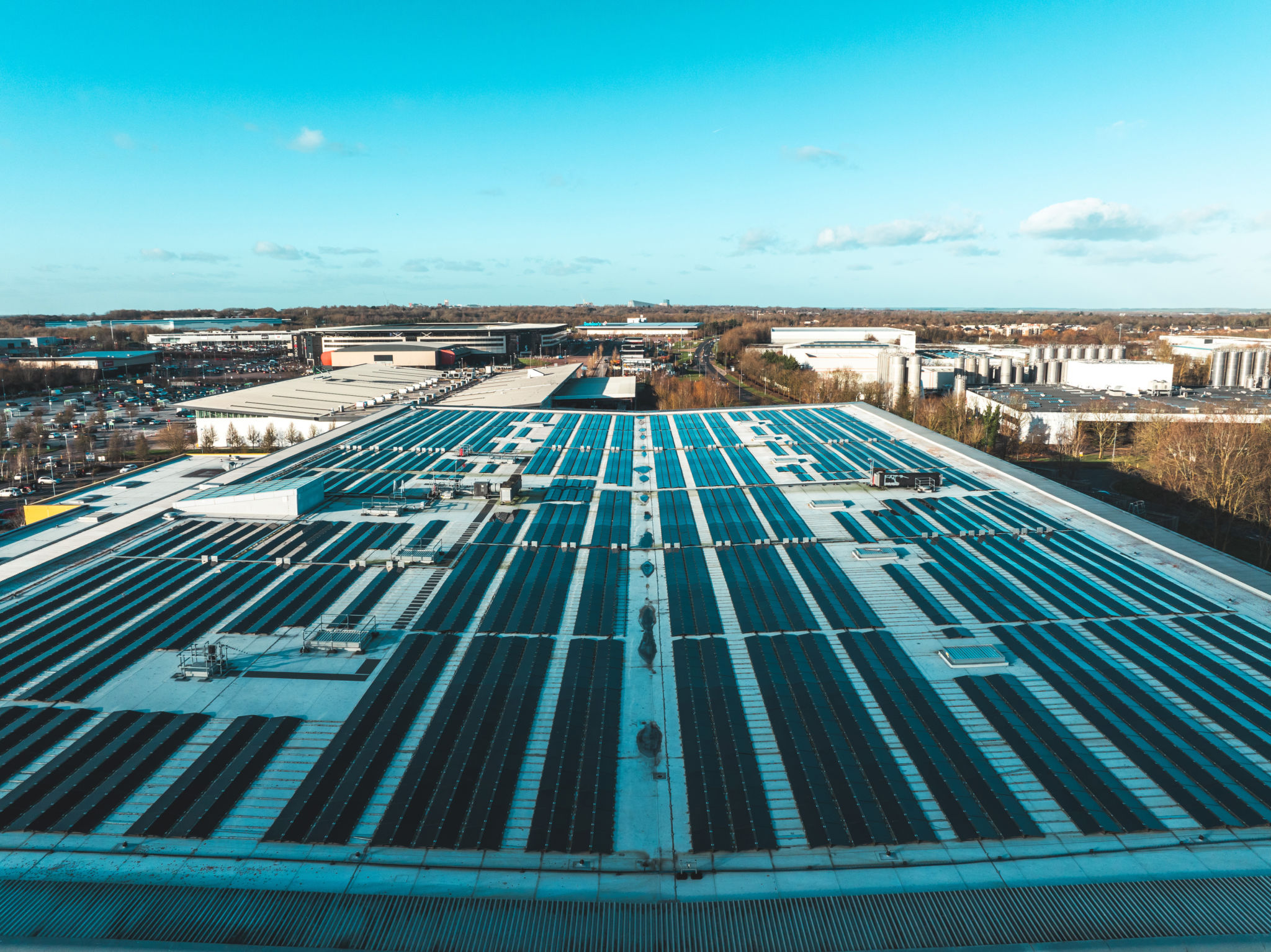 Aerial view of solar energy on the roofs of industrial plants Aerial view of solar energy on the roofs of industrial plants