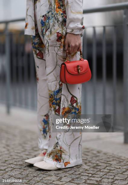 Sonia Lyson seen wearing Munthe white linen with colorful print pattern buttoned shirt, matching Munthe white linen with colorful print pattern long...