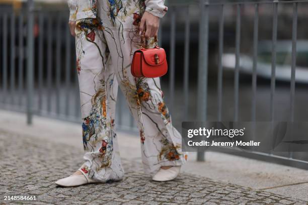 Sonia Lyson seen wearing Munthe white linen with colorful print pattern buttoned shirt, matching Munthe white linen with colorful print pattern long...