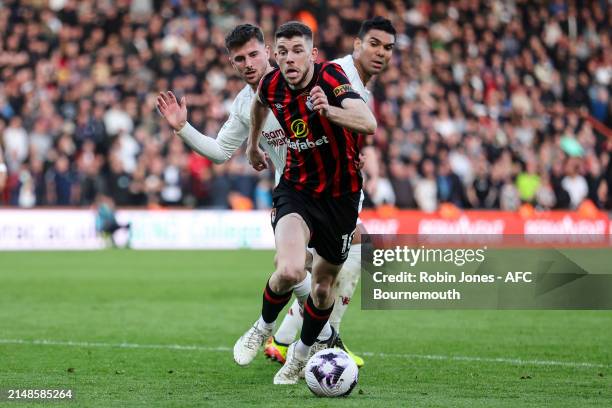 Ryan Christie of Bournemouth gets past Mason Mount and Casemiro of Manchester United during the Premier League match between AFC Bournemouth and...