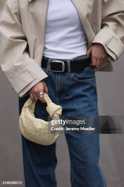 Sophia Geiss seen wearing Uniqlo white cotton basic top, Calvin Klein blue denim baggy wide leg jeans pants, black leather belt, Meotine creamy white...