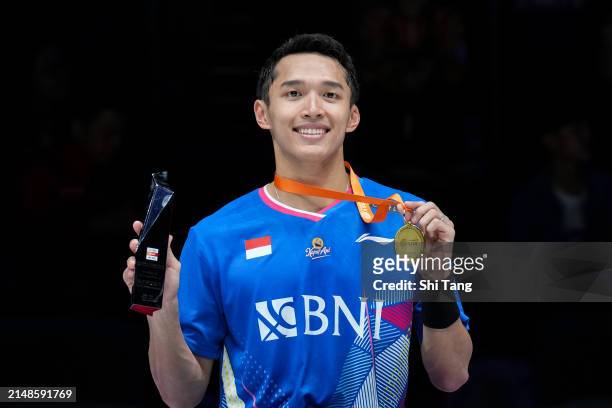 Jonatan Christie of Indonesia poses with the medal on the podium after the Men's Singles Final match against Li Shifeng of China during day six of...