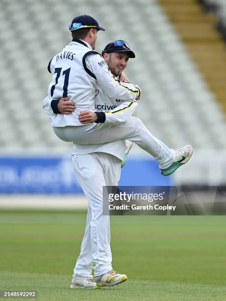 Ed Barnard of Warwickshire celebrates with captain Alex Davies after catching out Ollie Robinson of Durham during day three of the Vitality County...