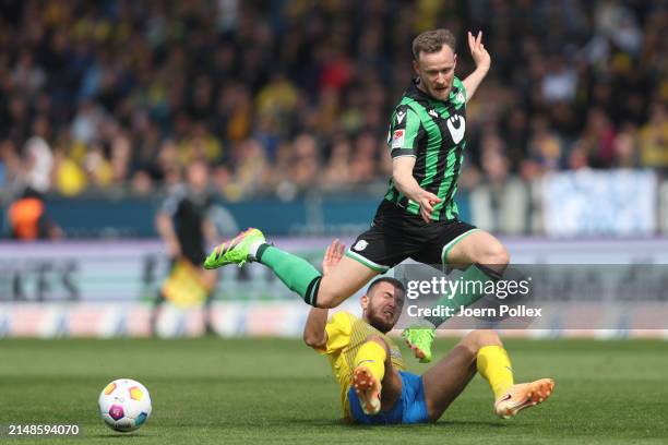 Hasan Kurucay of Braunschweig and Cedric Teuchert of Hannover compete for the ball during the Second Bundesliga match between Eintracht Braunschweig...