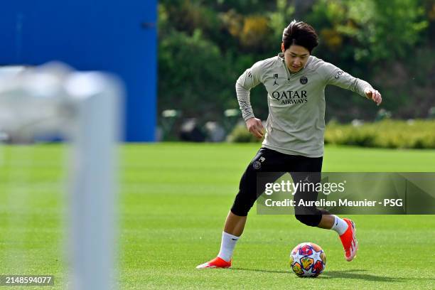 Kang In Lee runs with the ball during a Paris Saint-Germain training session at Campus PSG on April 14, 2024 in Paris, France.