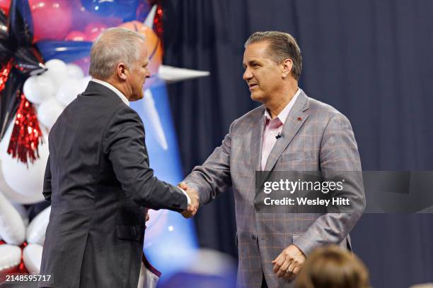 New Head Coach John Calipari of the Arkansas Razorbacks poses with Athletic Director Hunter Yurachek as he is introduced to the fans and the media at...