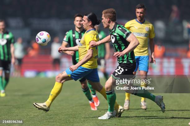 Ryan Philippe of Braunschweig and Marcel Halstenberg of Hannover compete for the ball during the Second Bundesliga match between Eintracht...