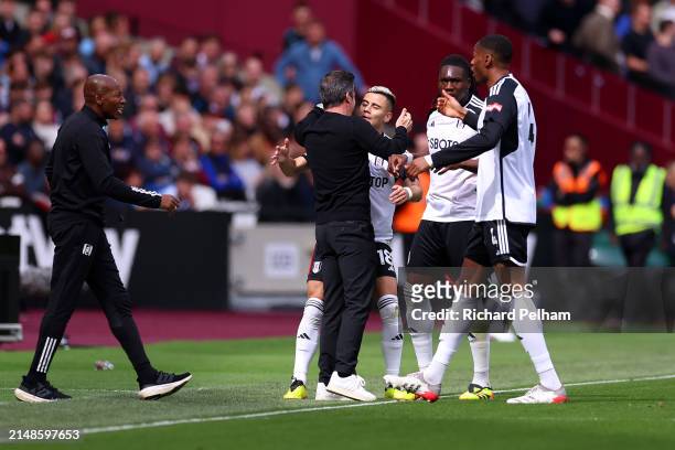 Andreas Pereira of Fulham celebrates scoring his team’s first goal during the Premier League match between West Ham United and Fulham FC at London...